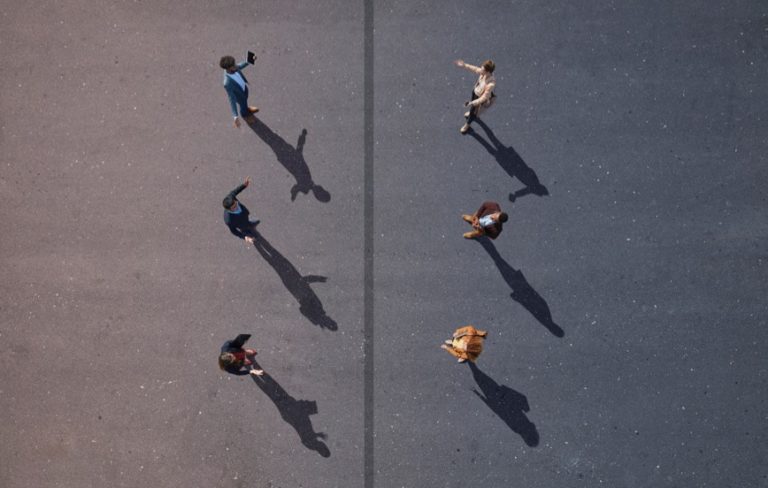 6 people total with 3 people on each side of a line looking at each other