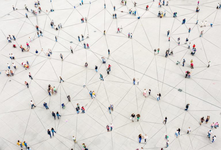 hundreds of people spread out but connected by lines, representing data points of a hybrid and remote work survey
